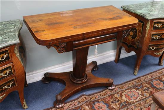 An early Victorian rosewood pedestal card table, with rectangular folding top, on octagonal tapering support, W.91cm